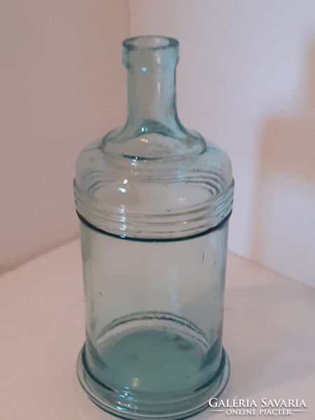 Old blue striped bottle with vintage ink bottle