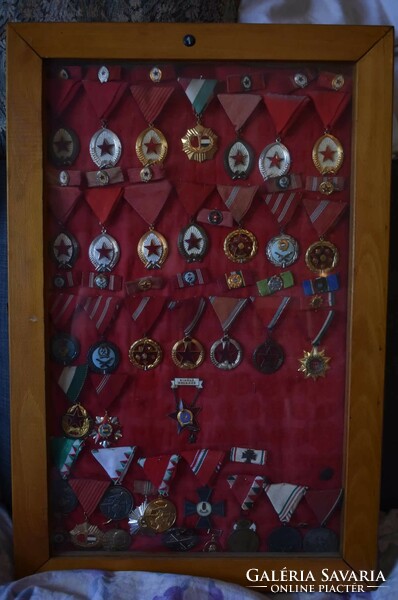 Collection of Soviet and Hungarian awards and badges in 15 glass panels