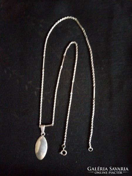 Silver chain with pendant.