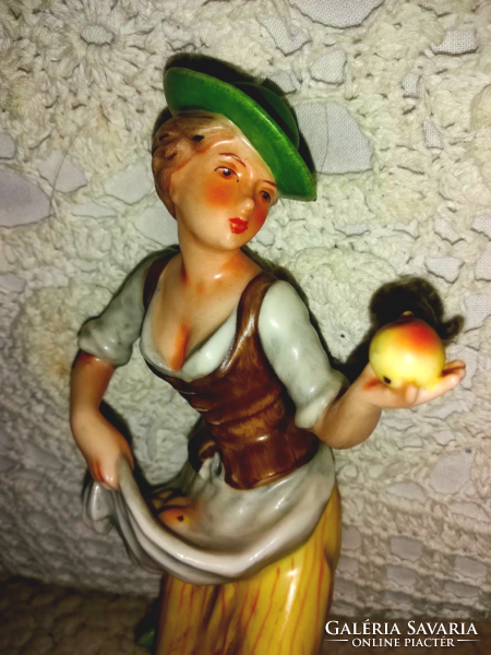 Hummel, goebel woman picking apples
