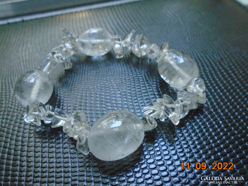 Bracelet made of 4 larger polished rock crystal beads and smaller irregular nuggets