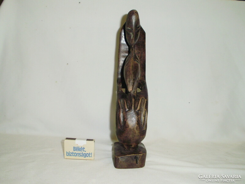 Oriental wooden sculpture - kissing couple