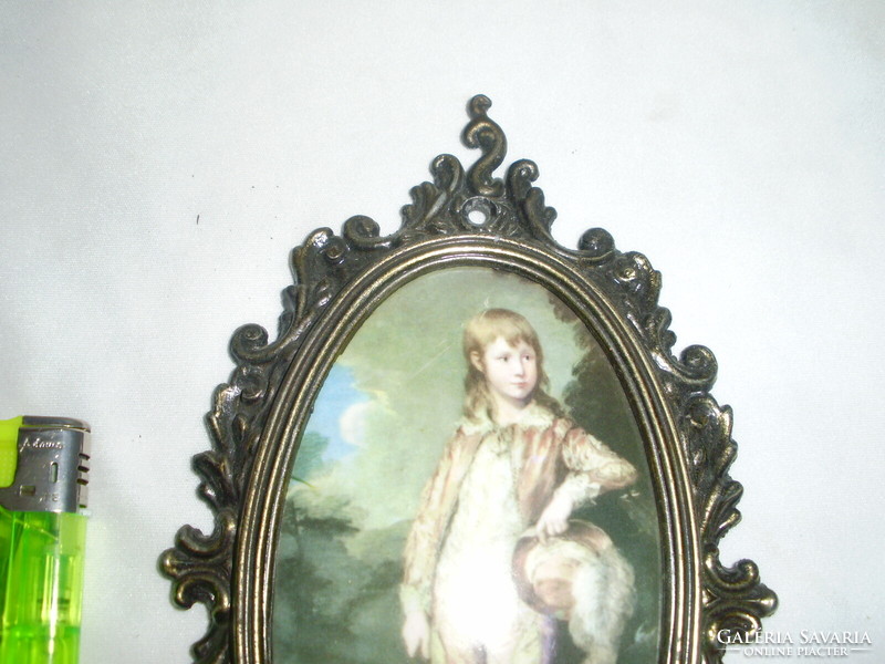 Decorative oval picture frame with a print on a convex base