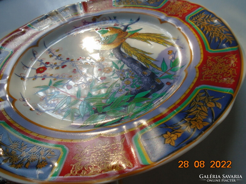 Hand-painted oriental marked wall plate with a bird flower pattern with bright protruding colors