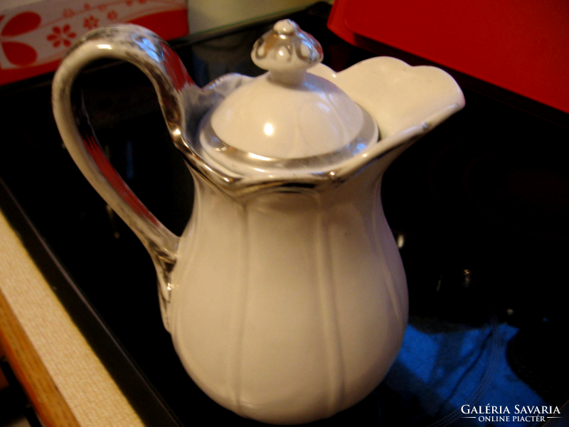 Antique shabby jug with silver border