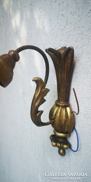 Antique at least 100-year-old wall arm wall lamp made of wood, gilded