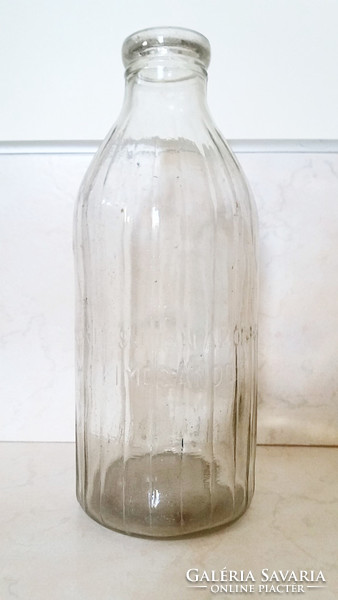 1 liter milk bottle with old milk bottle labeled milk