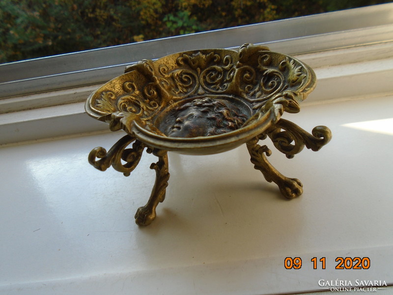 18 S rococo plastic putto with face, fire-gilded bronze bowl, with decorative tongs, on goat legs