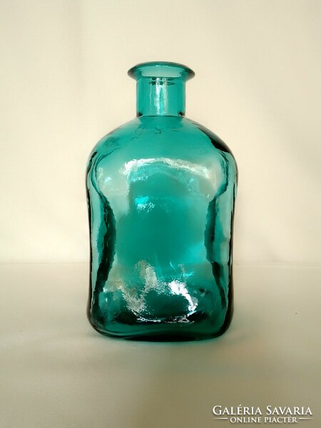Old beautiful special shaped square thick-walled turquoise green blue colored glass bottle from the 80s