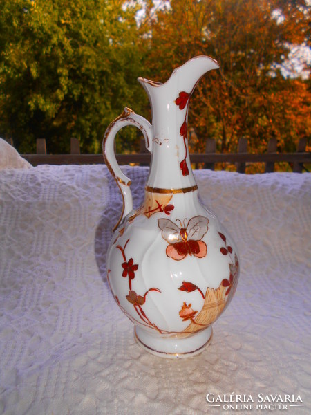Antique hand-painted porcelain carafe with a traditional oriental pattern