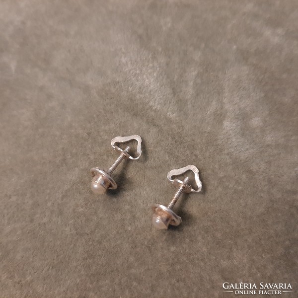 A pair of silver beaded coil earrings