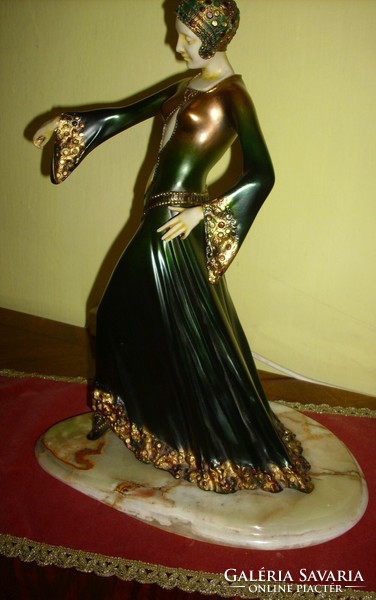 A beautiful art-deco dancing woman on onyx feet