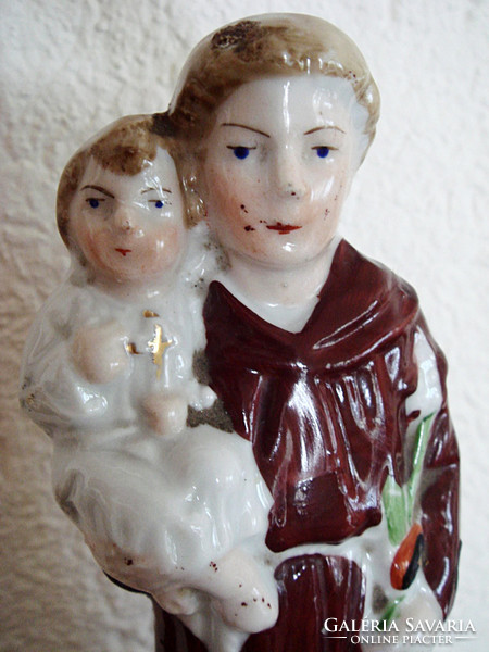 Old porcelain saint antal figure st. Anthony's religious statue is a blessing object