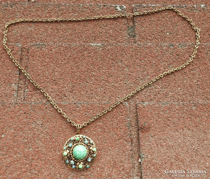 Old necklace with green stones and gold color