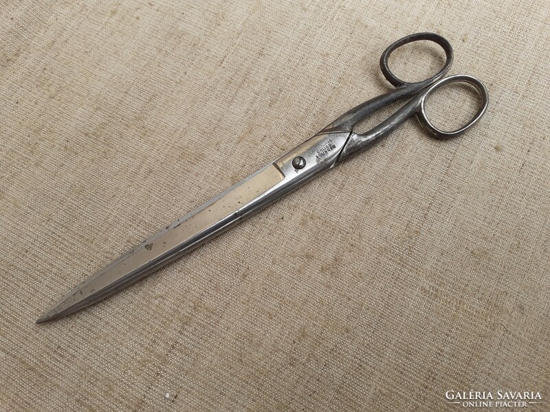 Old long marked tailor's scissors with an excellent edge