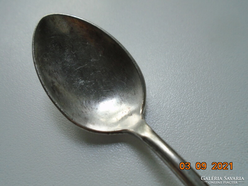 Antique silver-plated teaspoon with several markings