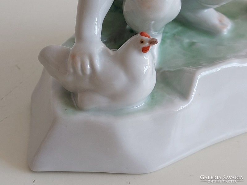 Old Zsolnay porcelain boy with white hen and ball