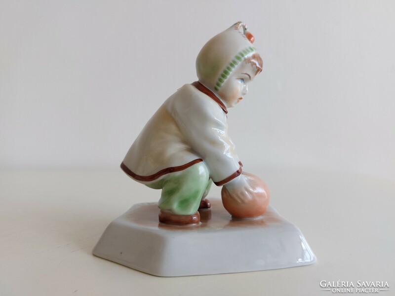 Old Zsolnay porcelain boy with a cap and a ball