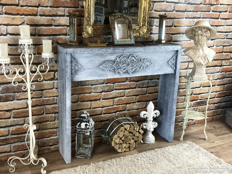 Vintage antique console table, in front of the fireplace.
