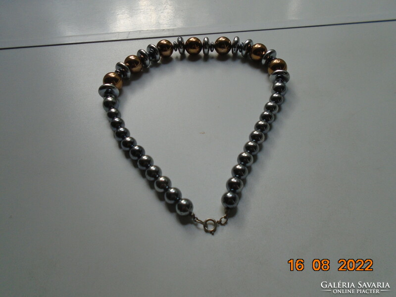Necklace made of gold-plated and silver-plated larger pearls