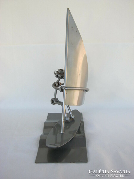 Loft design metal surfer figure