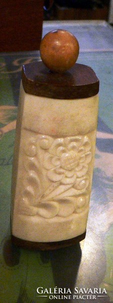 Marked carved bone holder with lid.