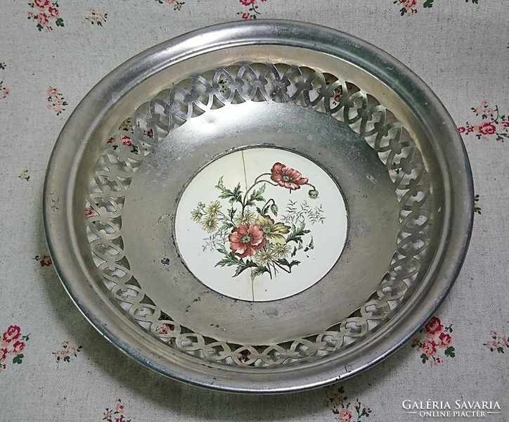 Fruit serving bowl with metal porcelain insert base with openwork sides.