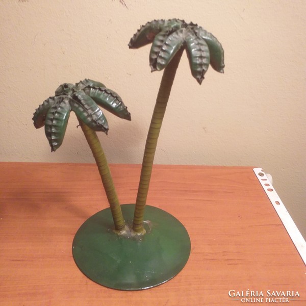 Old palm tree with metal joints
