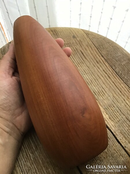 Old modern wooden vase with glass tube inside