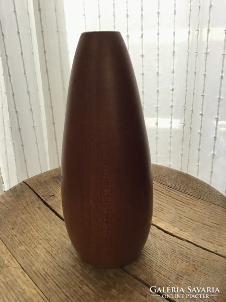 Old modern wooden vase with glass tube inside