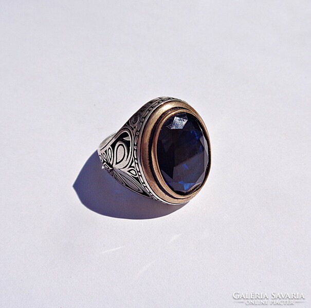 Large silver ring with blue stones