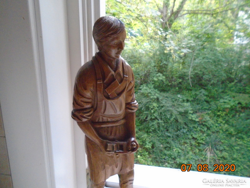 The master carpenter is a large statue carved from a piece of wood