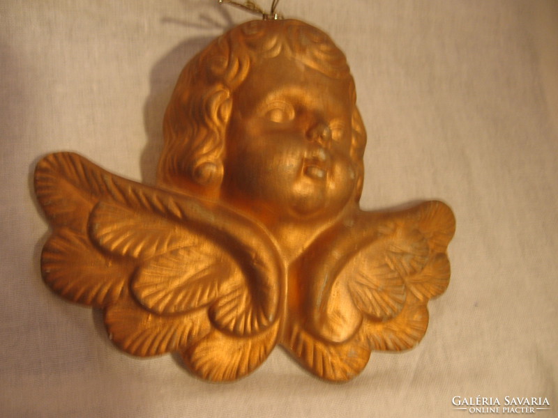 Gilded putto head with Christmas tree ornament