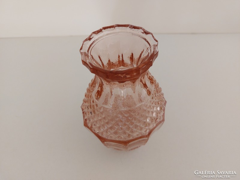 Old glass vase in pink vintage vase