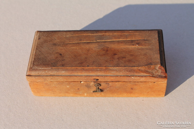 Pharmacy scale copper weights in a wooden box