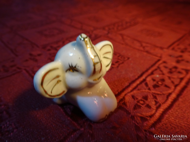 German porcelain mini elephant baby with gold decoration, length 3.5 cm. He has!