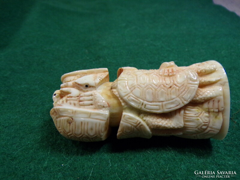 Bone figurine with turtles, hollow inside, I don't know what was kept inside