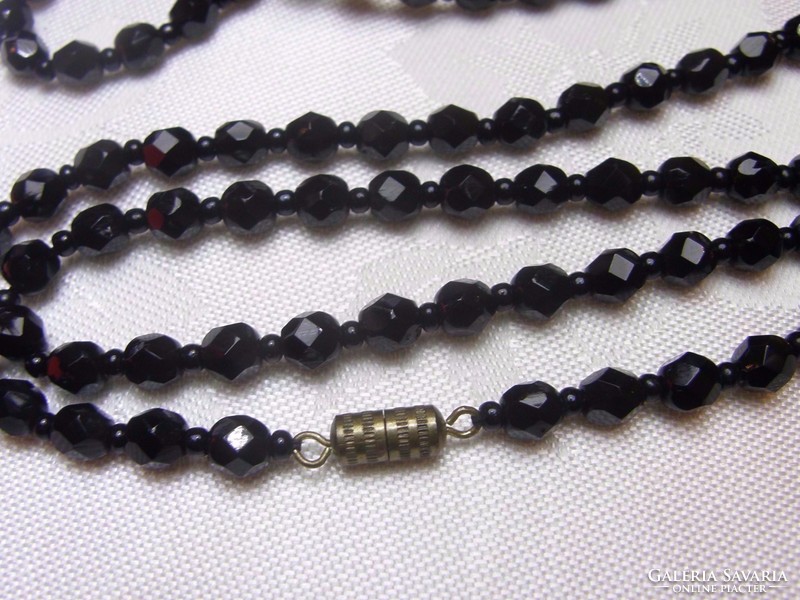 Row of old Czech faceted black glass beads