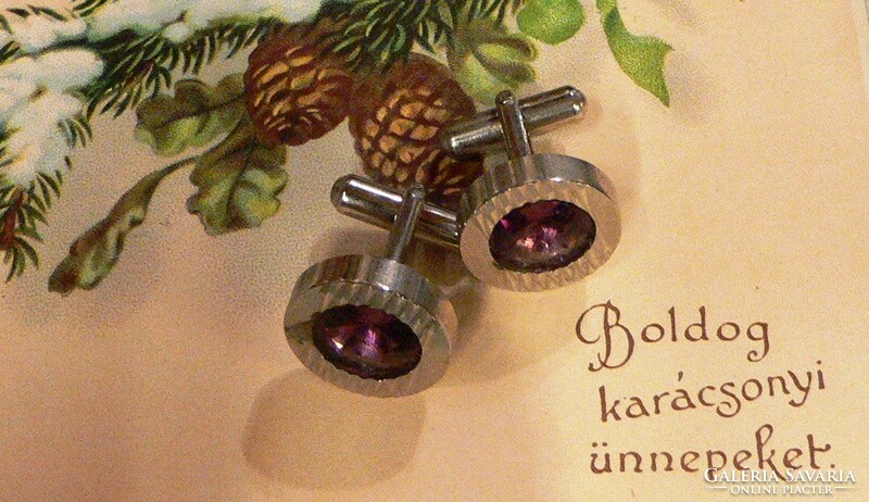 Pair of elegant metal cufflinks with purple stones