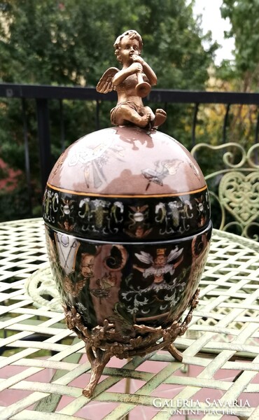 Beautiful baroque egg decorative object - a combination of porcelain and copper