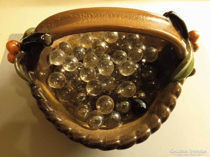 Marbles in a pottery holder