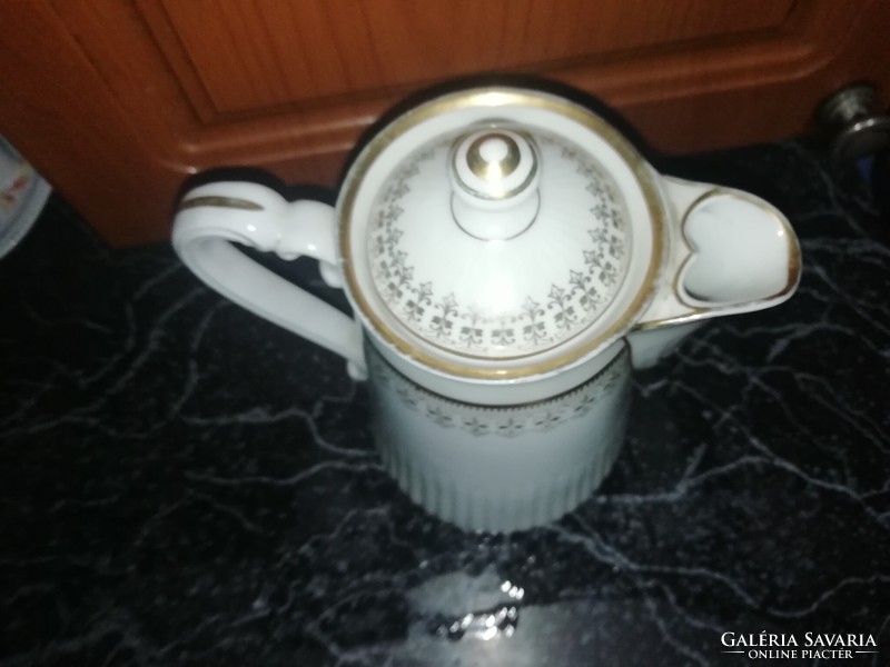 Antique porcelain tea pourer in perfect condition