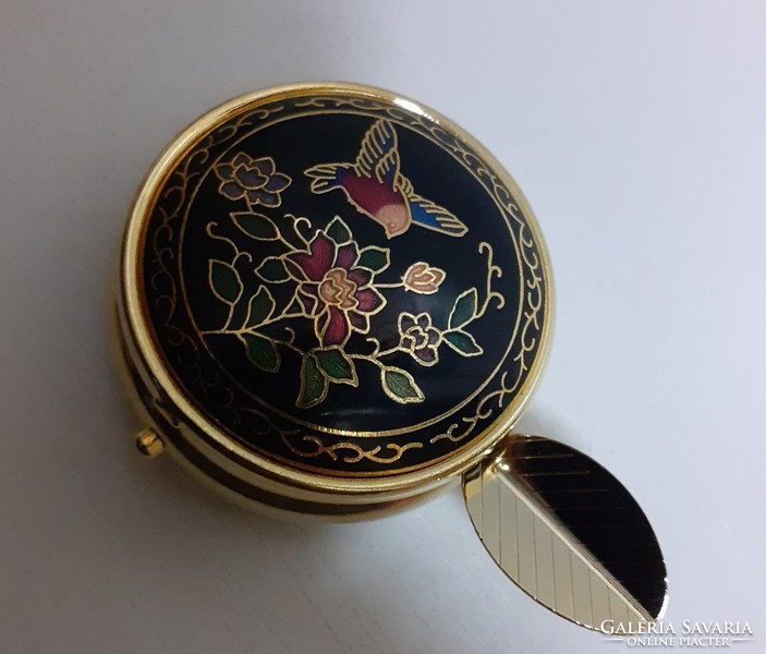 A small box of slenze that can be carried in a bag studded with a fire enamel inlay on a gilded chiselled top
