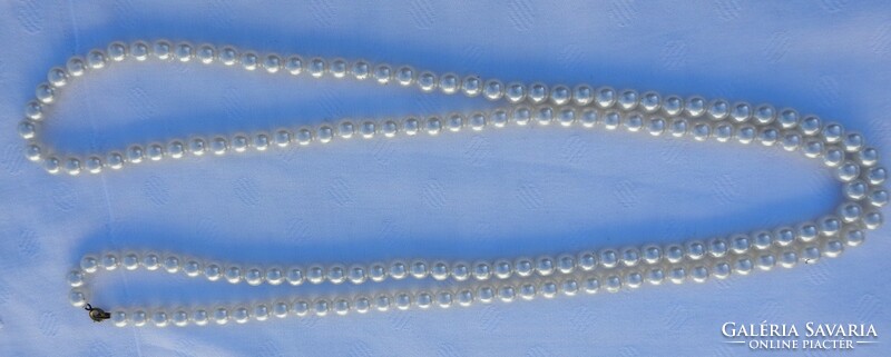 Old long string of pearls - pearl necklace