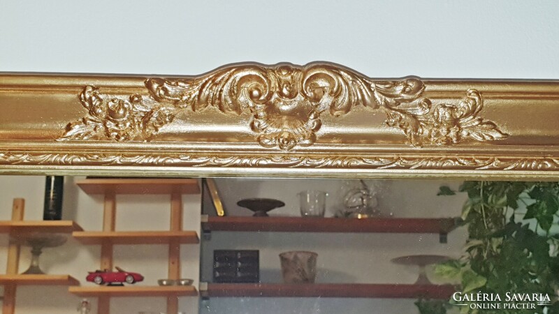 (H. ) Wonderful, antique, gold-colored, blonde frame, large mirror. 62X 131 cm.