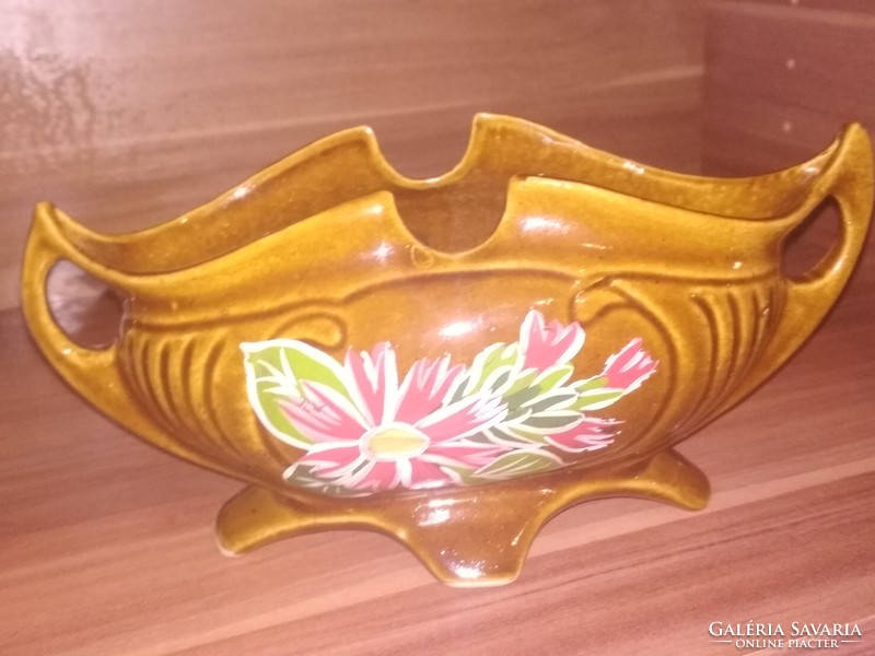 Boat-shaped majolica table in the middle