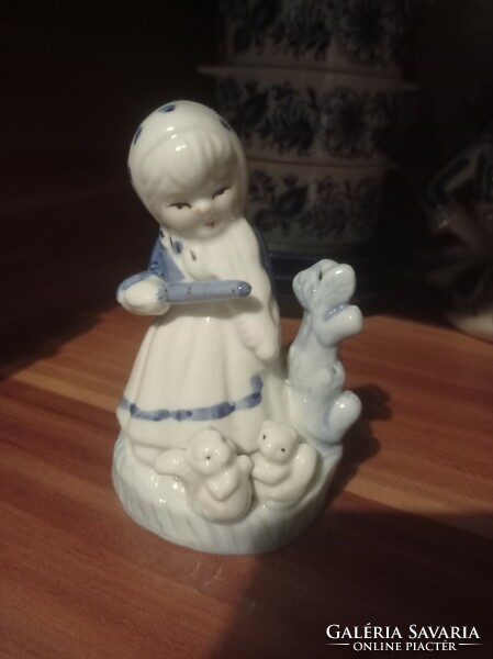 Porcelain figurine of a little girl with squirrels