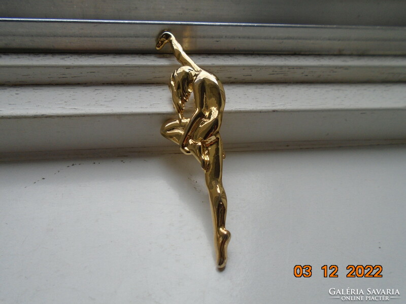 Modern gilded small plastic brooch, dancing nude
