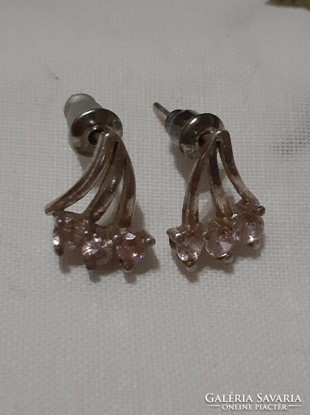 A pair of silver earrings with rose quartz stones