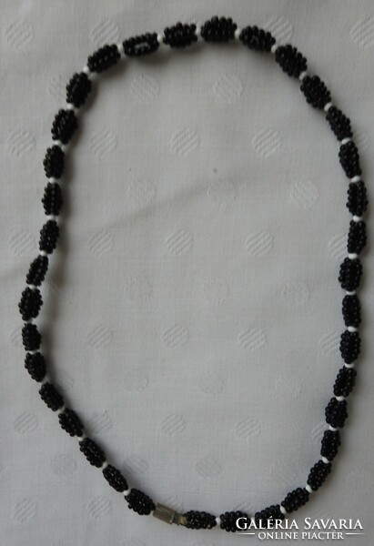 Black and white necklace with many small pearls